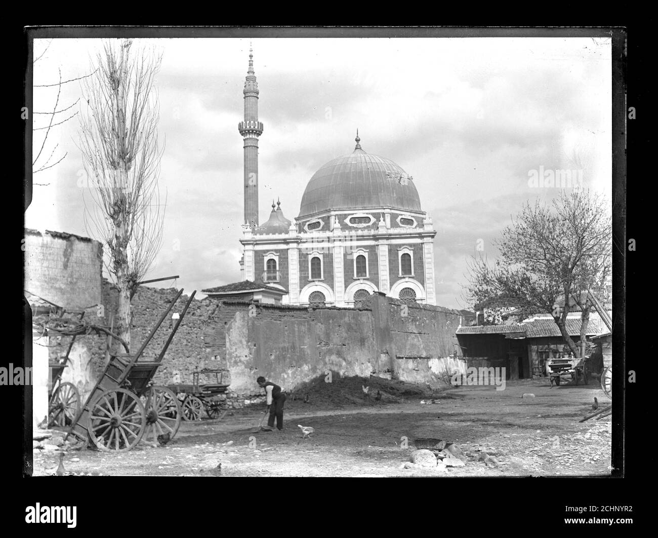 Kemeraltı Salepçioğlu Camii Mosque Turkey Izmir Smyrna around 1910. Salepçioğlu Mosque (Salepçioğlu Camii) is a Mosque in İzmir, Turkey located next to Konak Square in the heart of the city. The mosque which was constructed in the year 1905, is named after its patron Salepçizade Hacı Ahmet Efendi. The photograph shows the minaret in its original form; it has been destroyed during an earthquake in 1927. Photograph on dry glass plate from the Herry W. Schaefer collection. Stock Photo