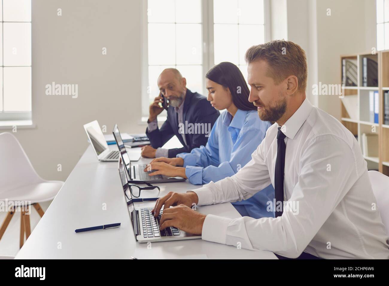 Group working with laptops hi-res stock photography and images - Alamy