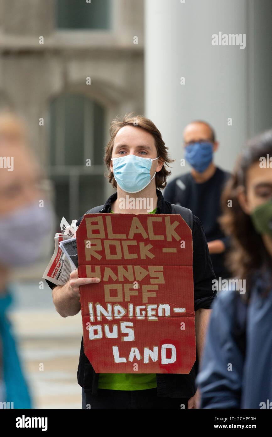Protester holding placard during Earth Strike demonstration outside the BlackRock financial institution, London, 5 September 2020 Stock Photo
