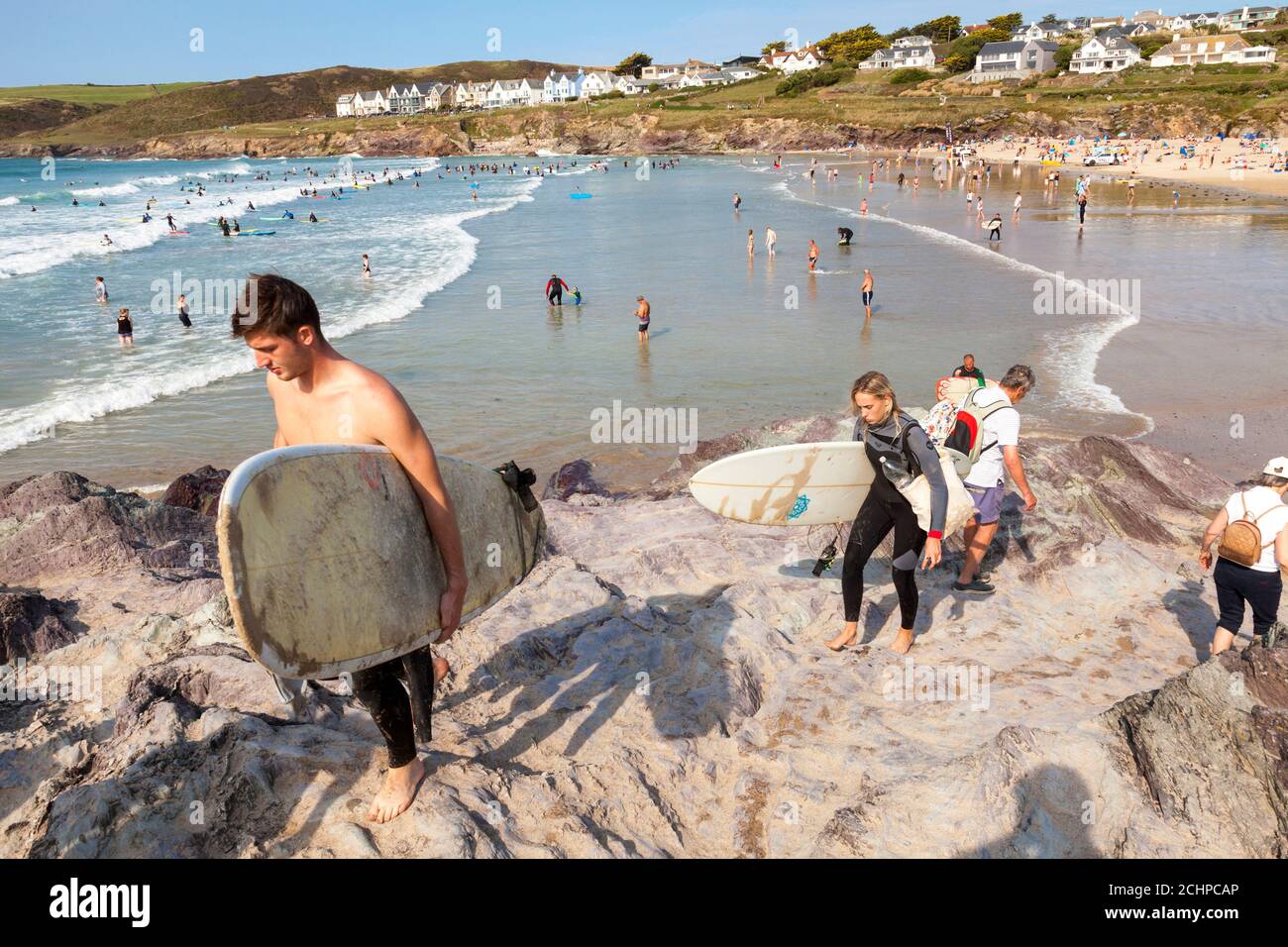 Polzeath, Cornwall, UK. 14th September 2020.  Holidaymakers enjoy warm sunshine  on Polzeath Beach on North Cornwall's Atlantic coast. Stock Photo