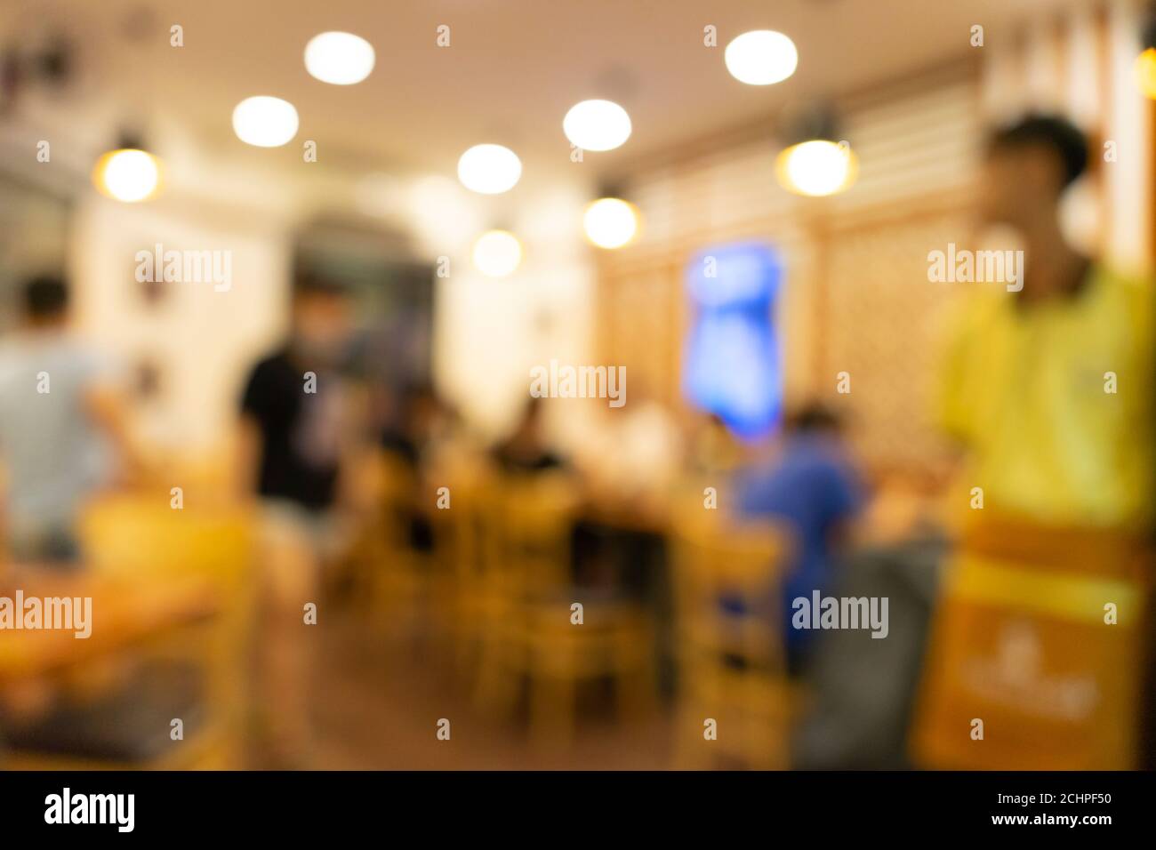 Blurred background of Vietnamese restaurant with people. Food and drink