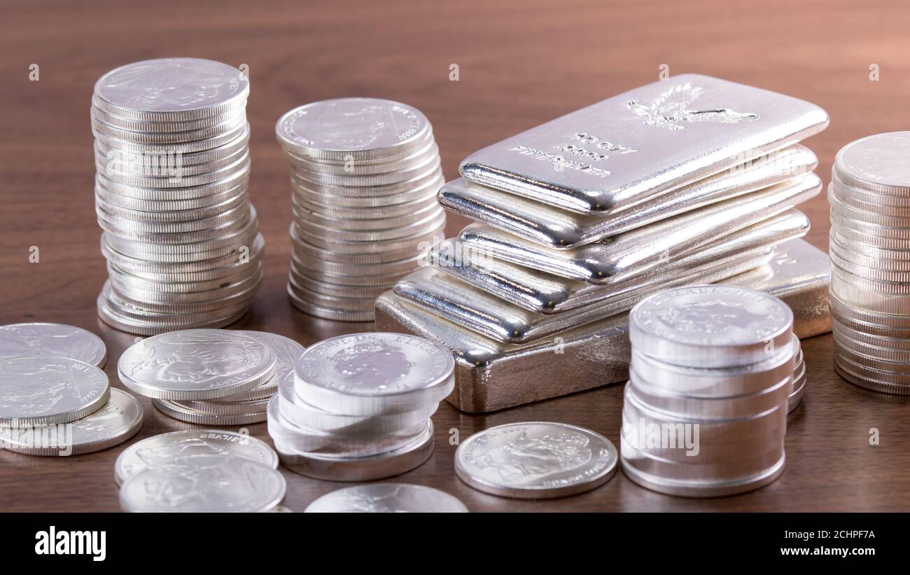 stack of metal coins neatly composed lie on a white wooden table Stock  Photo - Alamy