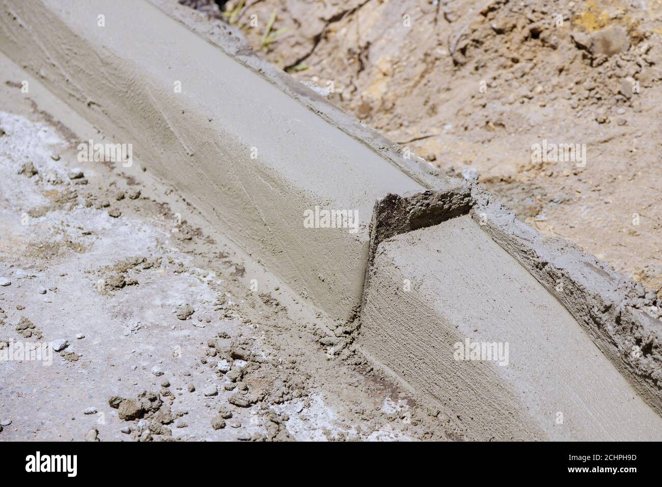 Repair of the sidewalk preparing to get ready to installation of the curb before reconstruction of the sidewalk and curbs. Stock Photo