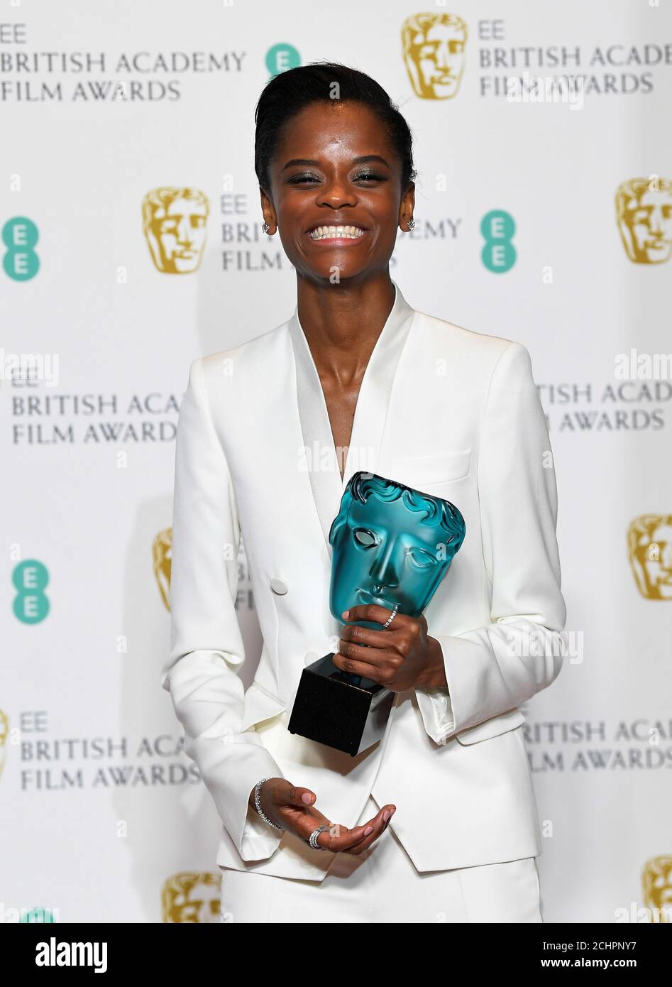 Letitia Wright holds her award for EE Rising Star at the British