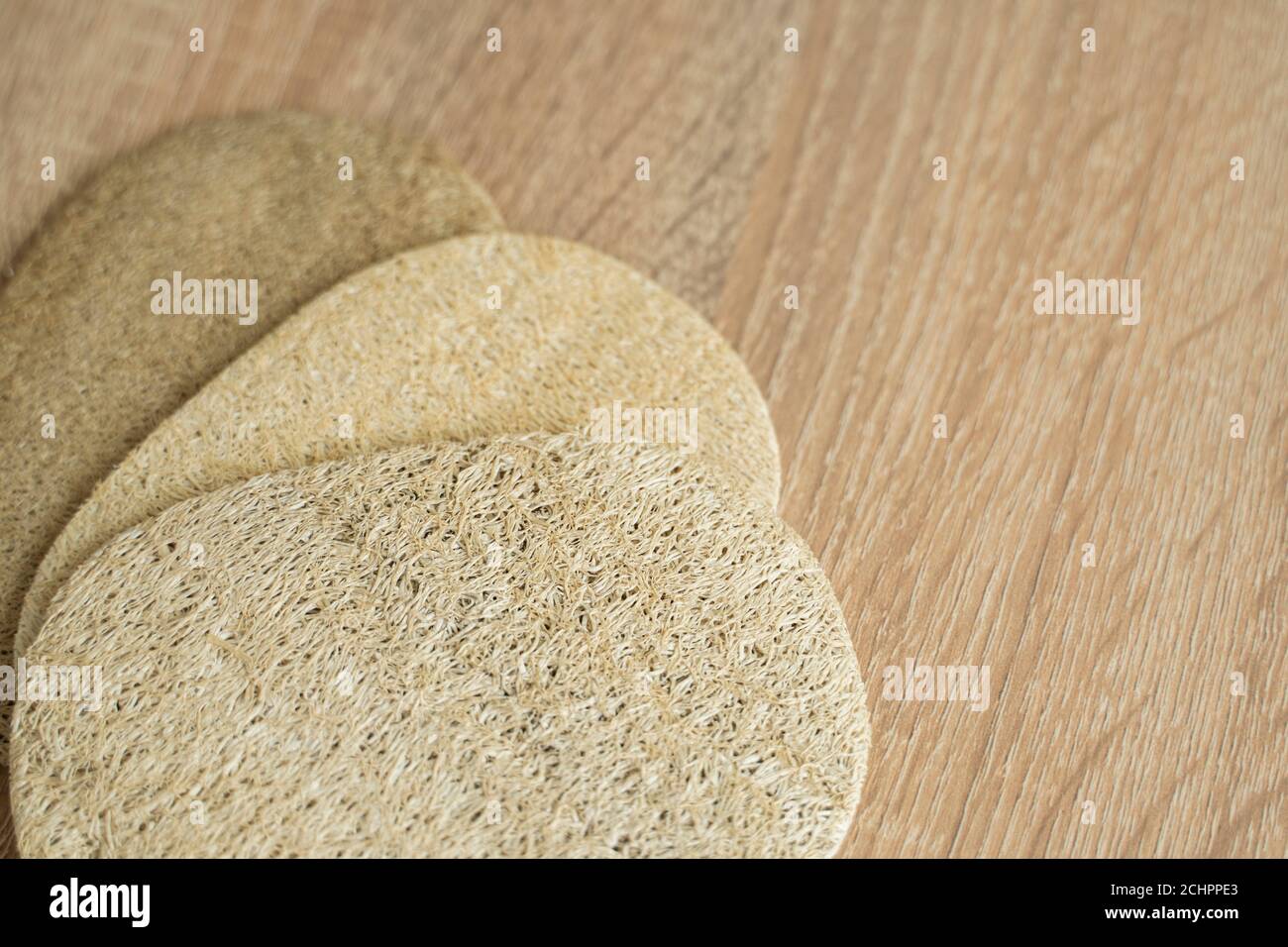 Natural loofah kitchen dish washing sponges. Eco friendly dishwashing sponge on a table, top
