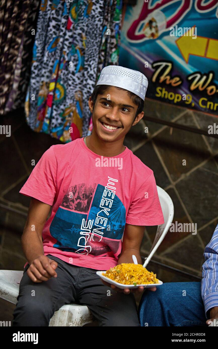 Indian boy with street food, Johannesburg Stock Photo