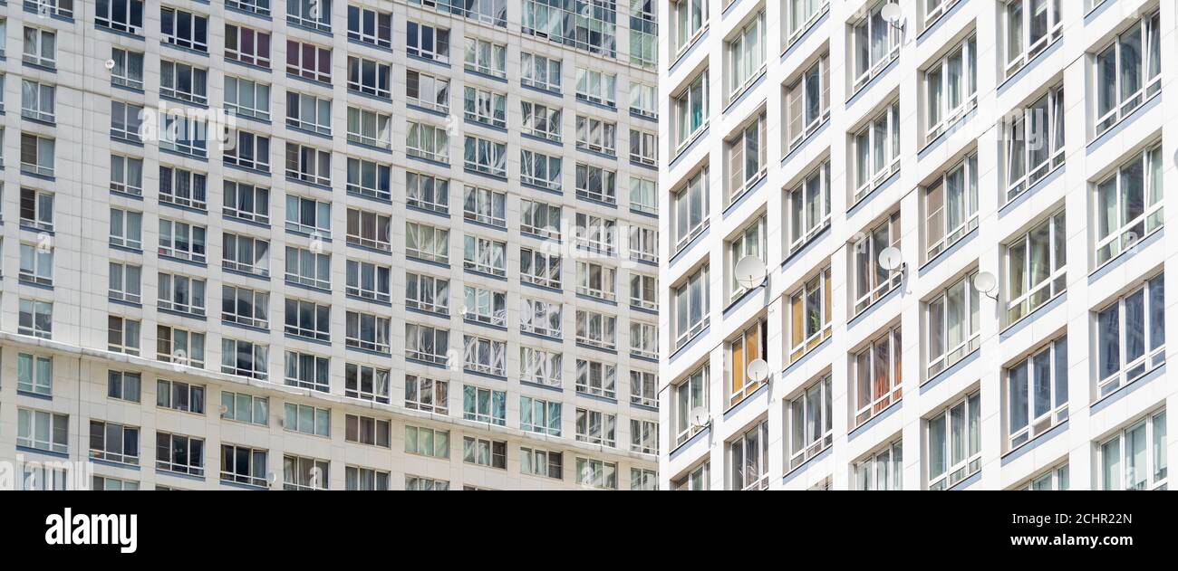 Aerial view of a tall residential apartment building with many windows ...