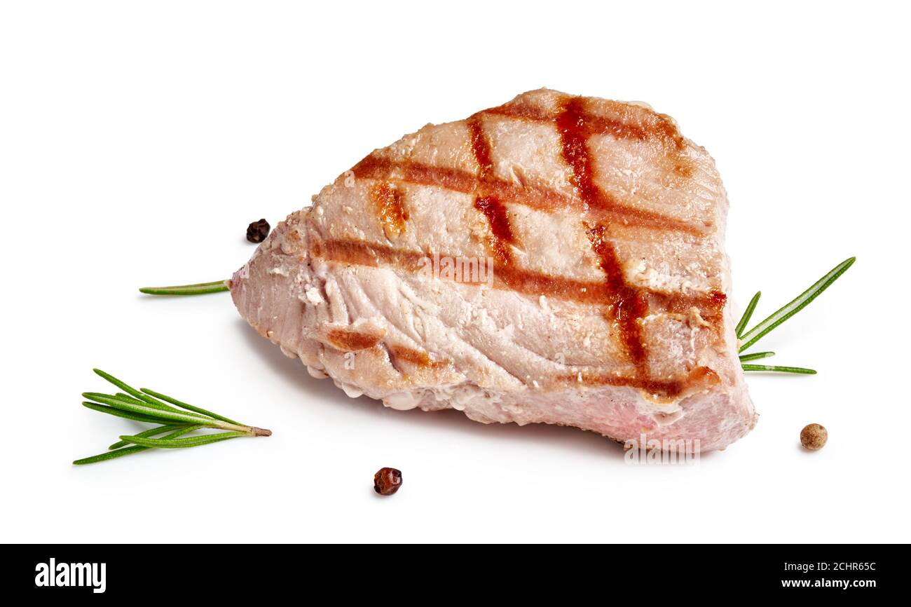 Grilled tuna steak with rosemary and spices isolated on white Stock Photo