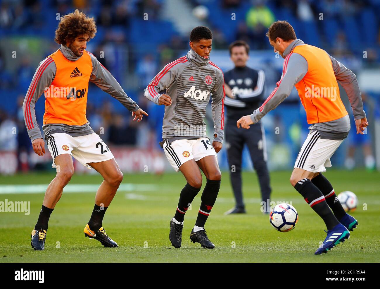 Soccer Football - Premier League - Brighton & Hove Albion v Manchester United - The American Express Community Stadium, Brighton, Britain - May 4, 2018 Manchester United's Marouane Fellaini, Marcus Rashford and Nemanja Matic during the warm up before the match REUTERS/Eddie Keogh EDITORIAL USE ONLY. No use with unauthorized audio, video, data, fixture lists, club/league logos or "live" services. Online in-match use limited to 75 images, no video emulation. No use in betting, games or single club/league/player publications. Please contact your account representative for further details Stock Photo