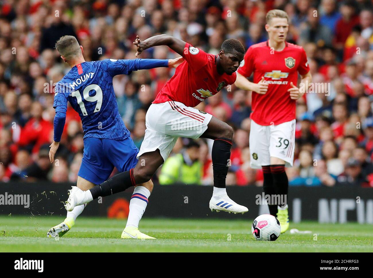 Soccer Football - Premier League - Manchester United v Chelsea - Old Trafford, Manchester, Britain - August 11, 2019  Manchester United's Paul Pogba in action with Chelsea's Mason Mount   REUTERS/Phil Noble  EDITORIAL USE ONLY. No use with unauthorized audio, video, data, fixture lists, club/league logos or 'live' services. Online in-match use limited to 75 images, no video emulation. No use in betting, games or single club/league/player publications.  Please contact your account representative for further details. Stock Photo