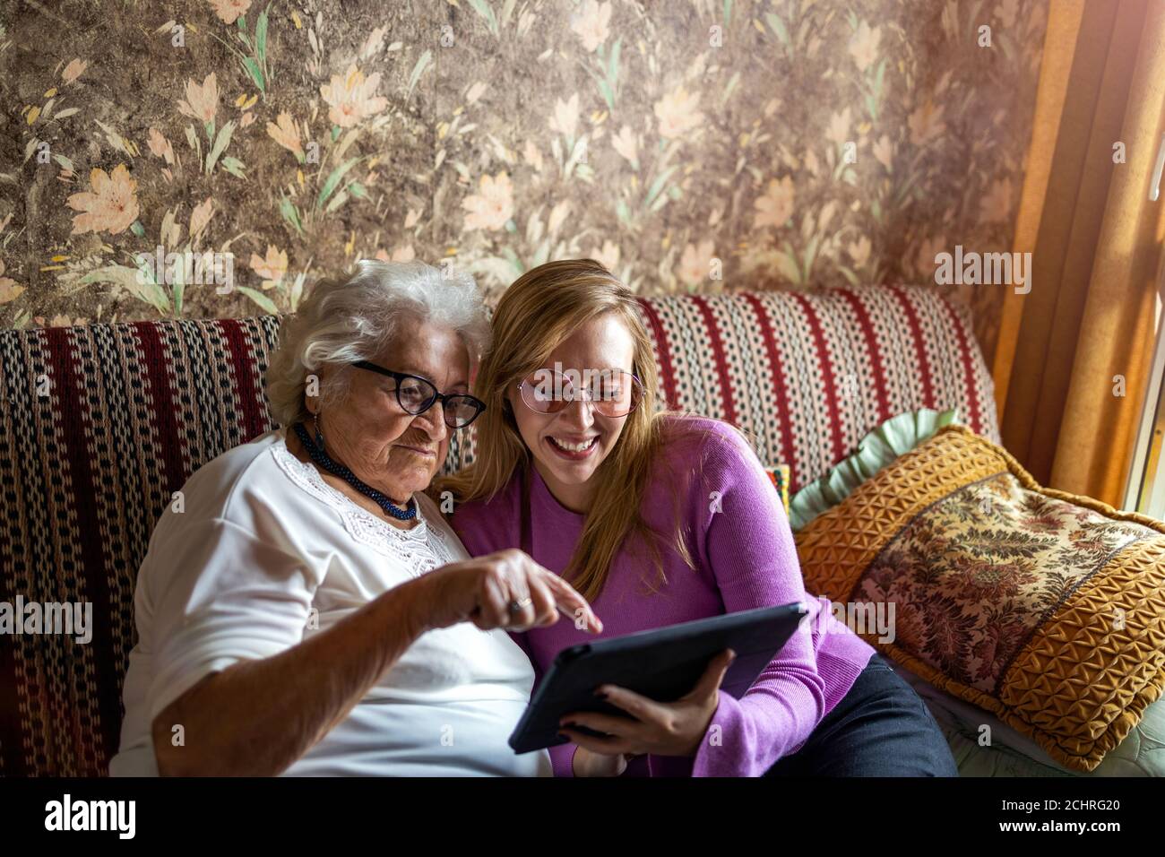Casual woman sitting on sofa hi-res stock photography and images - Alamy