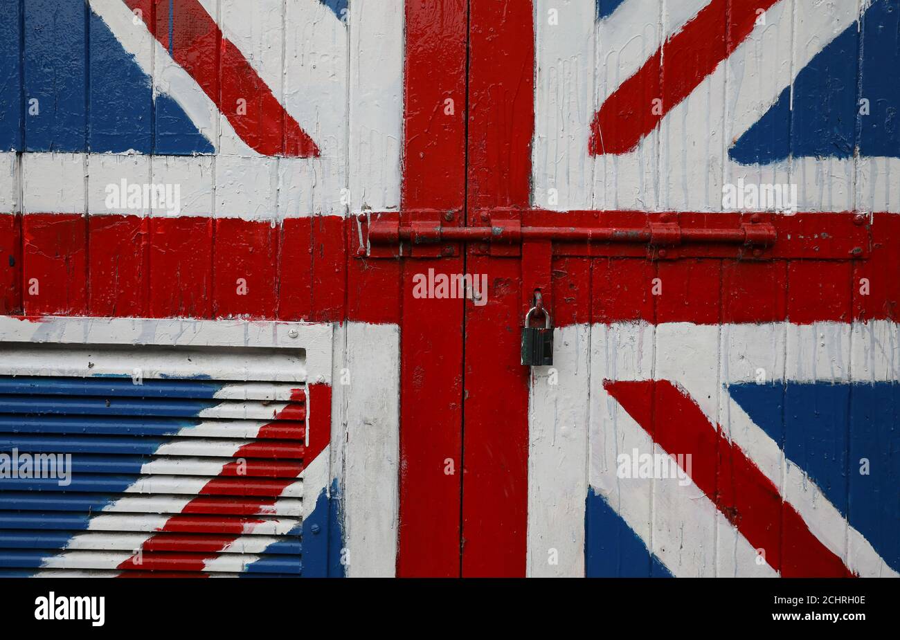 A padlock is seen on a door covered with a Union Jack mural on the Fountain Estate in Londonderry, Northern Ireland October 15, 2019. Picture taken October 15, 2019. REUTERS/Phil Noble Stock Photo
