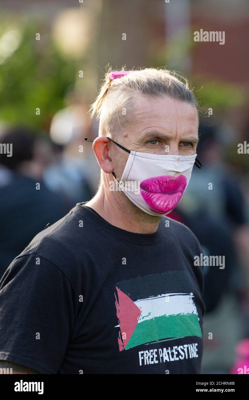 Portrait of a man in comical face mask at an Extinction Rebellion demonstration, Parliament Square, London, 5 September 2020 Stock Photo