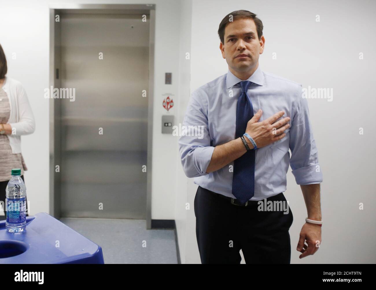 Republican U.S. presidential candidate Marco Rubio is seen pledge allegiance to the flag at backstage before being introduced at a campaign event at Palm Beach Atlantic University in West Palm Beach, Florida March 14, 2016.     REUTERS/Carlo Allegri Stock Photo