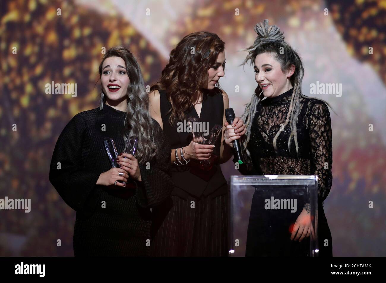 French band L.E.J members singer Elisa Paris, French singer Lucie Lebrun  and Juliette Saumagne react after receiving their tour revelation award  during the 32nd Victoires de la Musique French music awards ceremony
