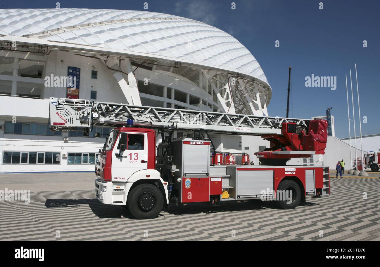 Members of the Russian Emergencies Ministry hold a drill, dedicated to fire fighting and an emergency response during international competitions, outside the Fisht Olympic Stadium, which will host matches of the 2018 FIFA World Cup, in Sochi, Russia April 5, 2018. REUTERS/Kazbek Basayev Stock Photo