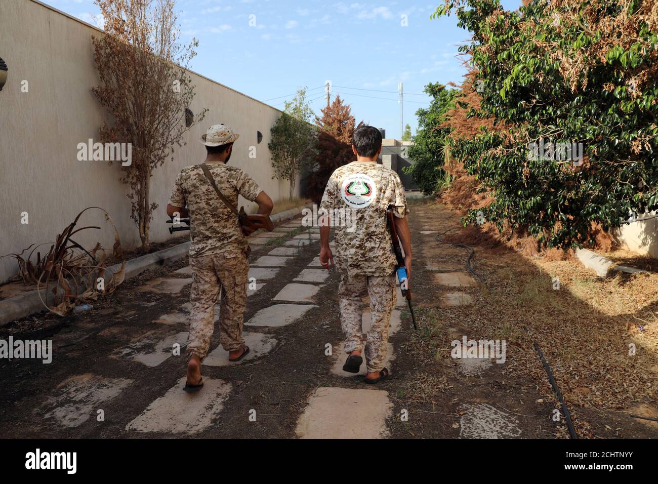 Members of the Libyan internationally recognised government forces carry  weapons in Ain Zara, Tripoli, Libya October 14, 2019. Picture taken October  14, 2019. REUTERS/Ismail Zitouny Stock Photo - Alamy