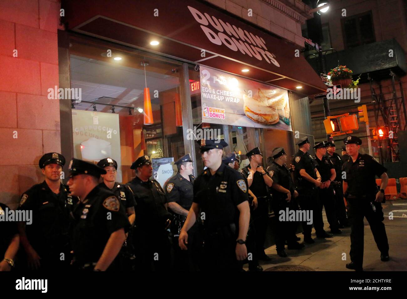 Police stand outside a Dunkin' Donuts shop during a Black Lives Matter protest near City Hall in Manhattan, New York, U.S., August 1, 2016.  REUTERS/Andrew Kelly Stock Photo