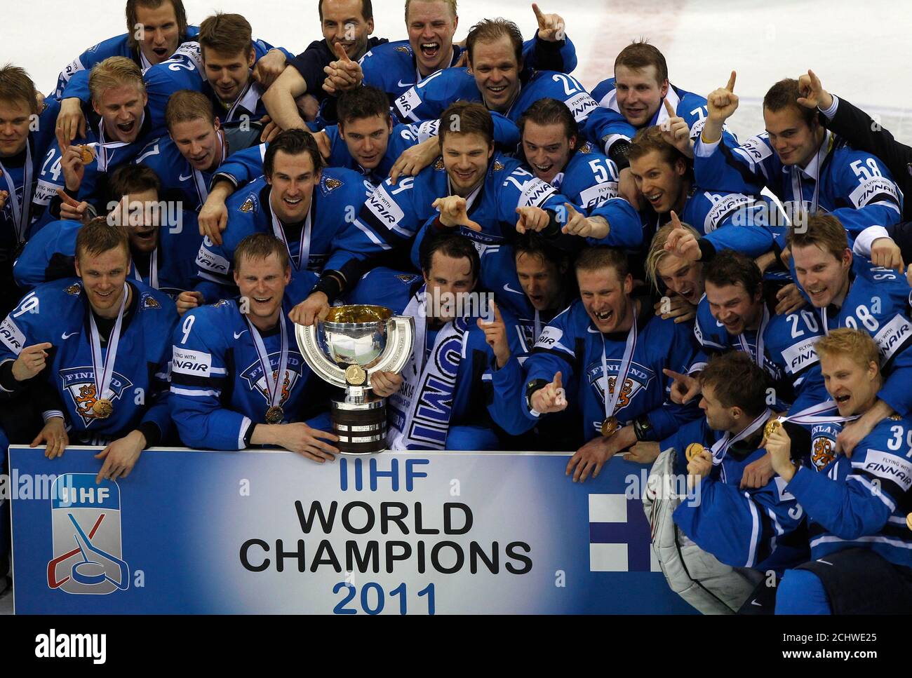 Finland's players celebrate with the trophy after they won the Ice Hockey  World Championship final against Sweden in Bratislava May 15, 2011. Finland  beat Sweden 6-1 to win the gold medal on