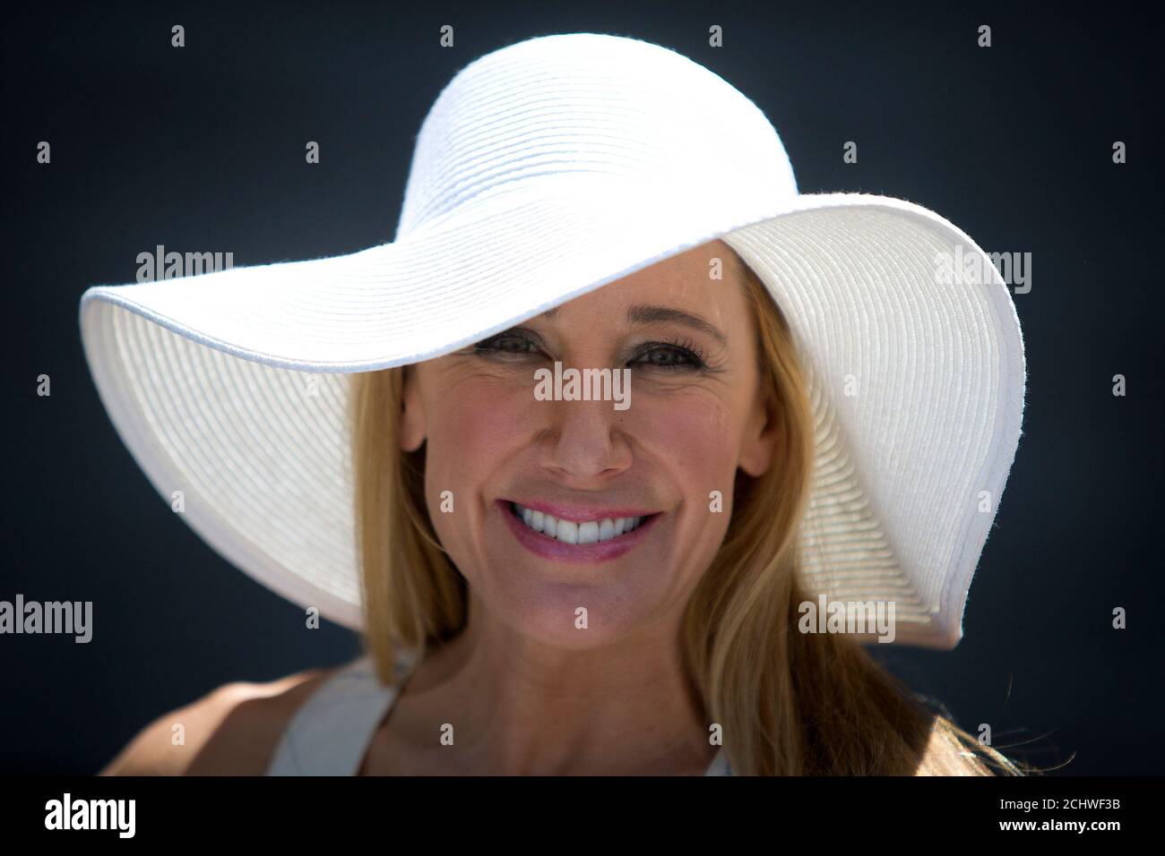 Diana Val poses for a  portrait with her hat before the 146th running of the 2014 Belmont Stakes in Elmont, New York June 7, 2014.      REUTERS/Carlo Allegri (UNITED STATES - Tags: SPORT HORSE RACING SOCIETY FASHION) Stock Photo