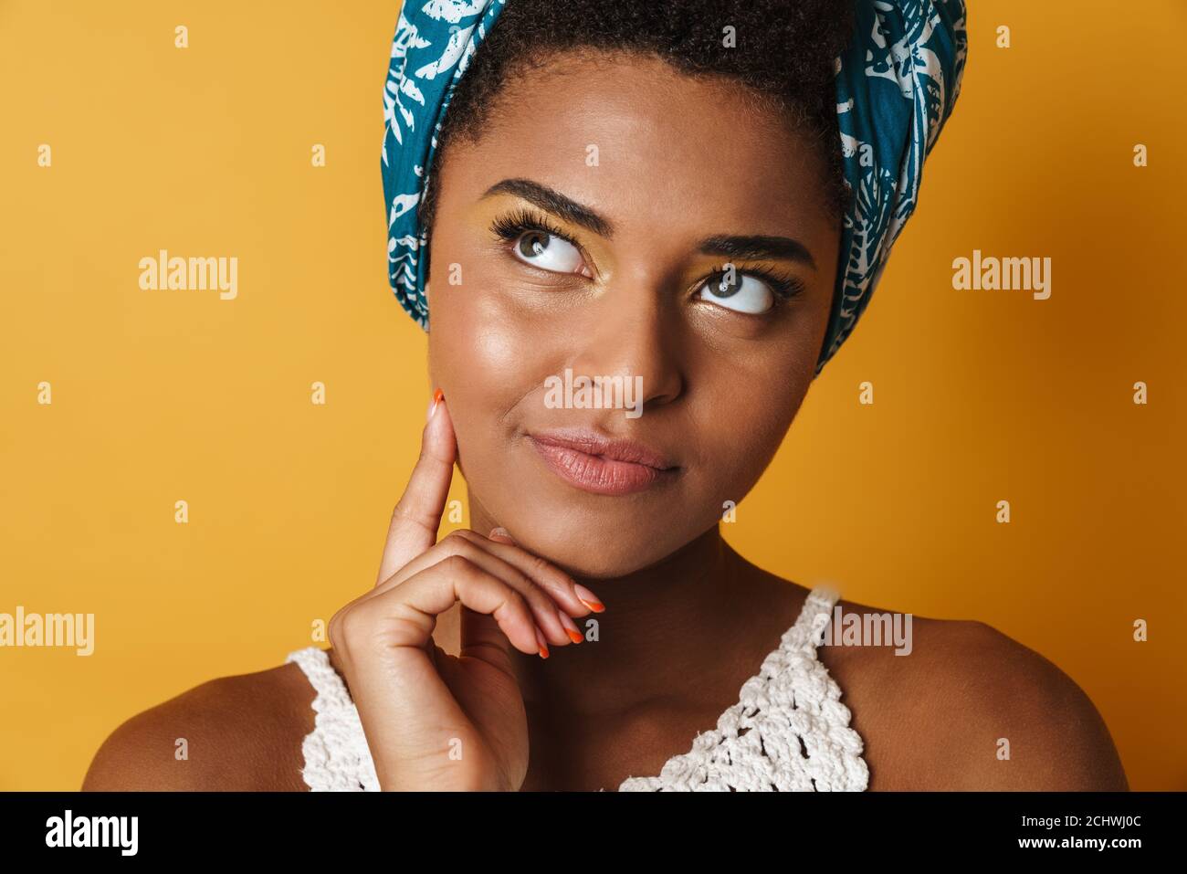 Image of serious african american woman thinking and looking upward ...