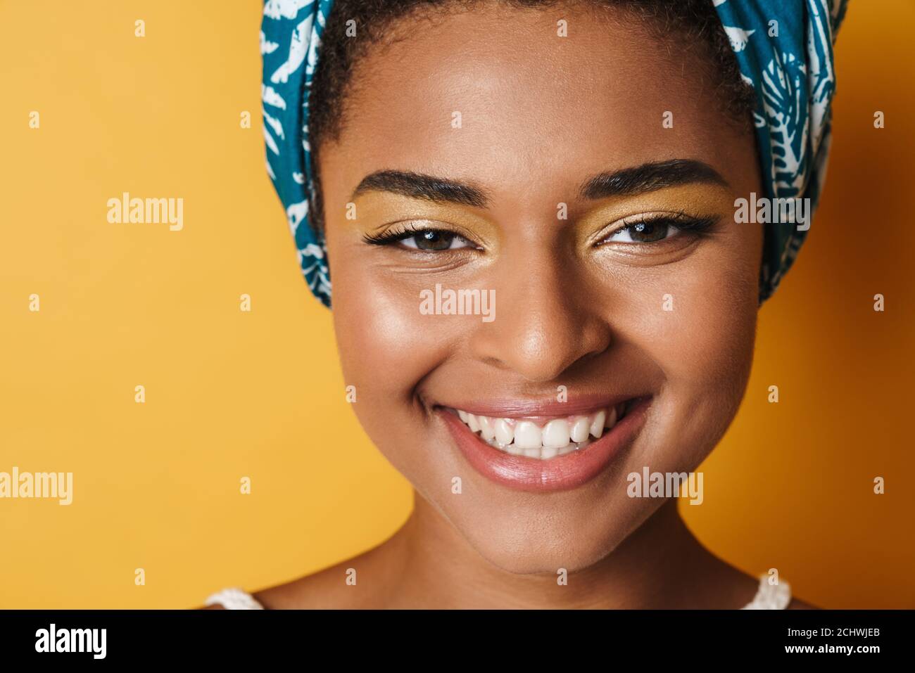 Image of funny african american woman posing and smiling on camera
