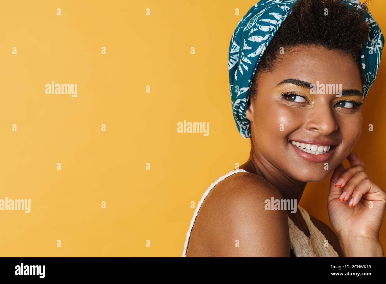 Image of funny african american woman posing and smiling on camera