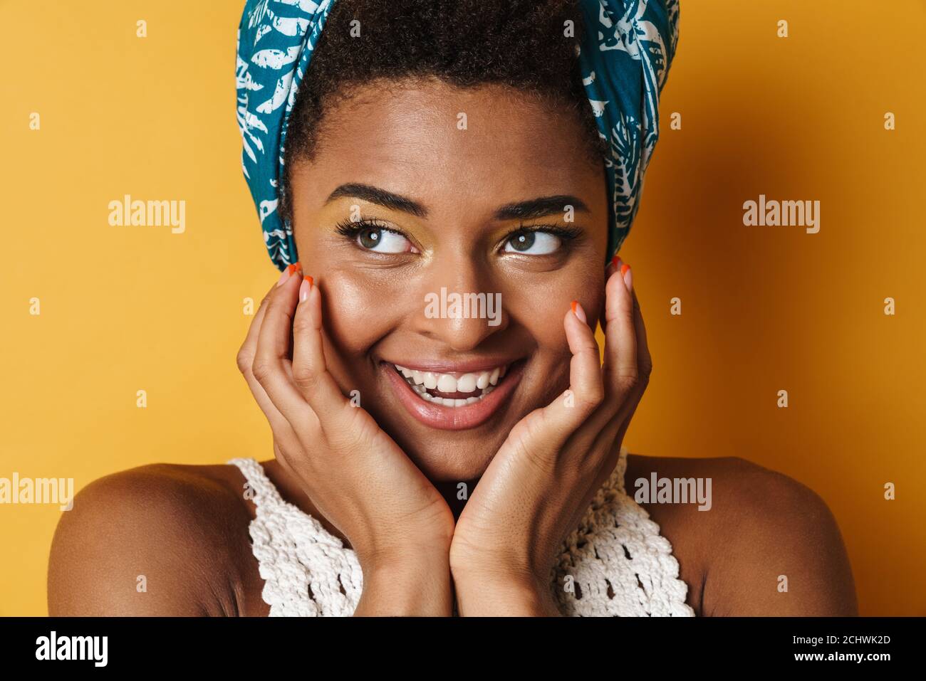 Image of funny african american woman posing and laughing on camera