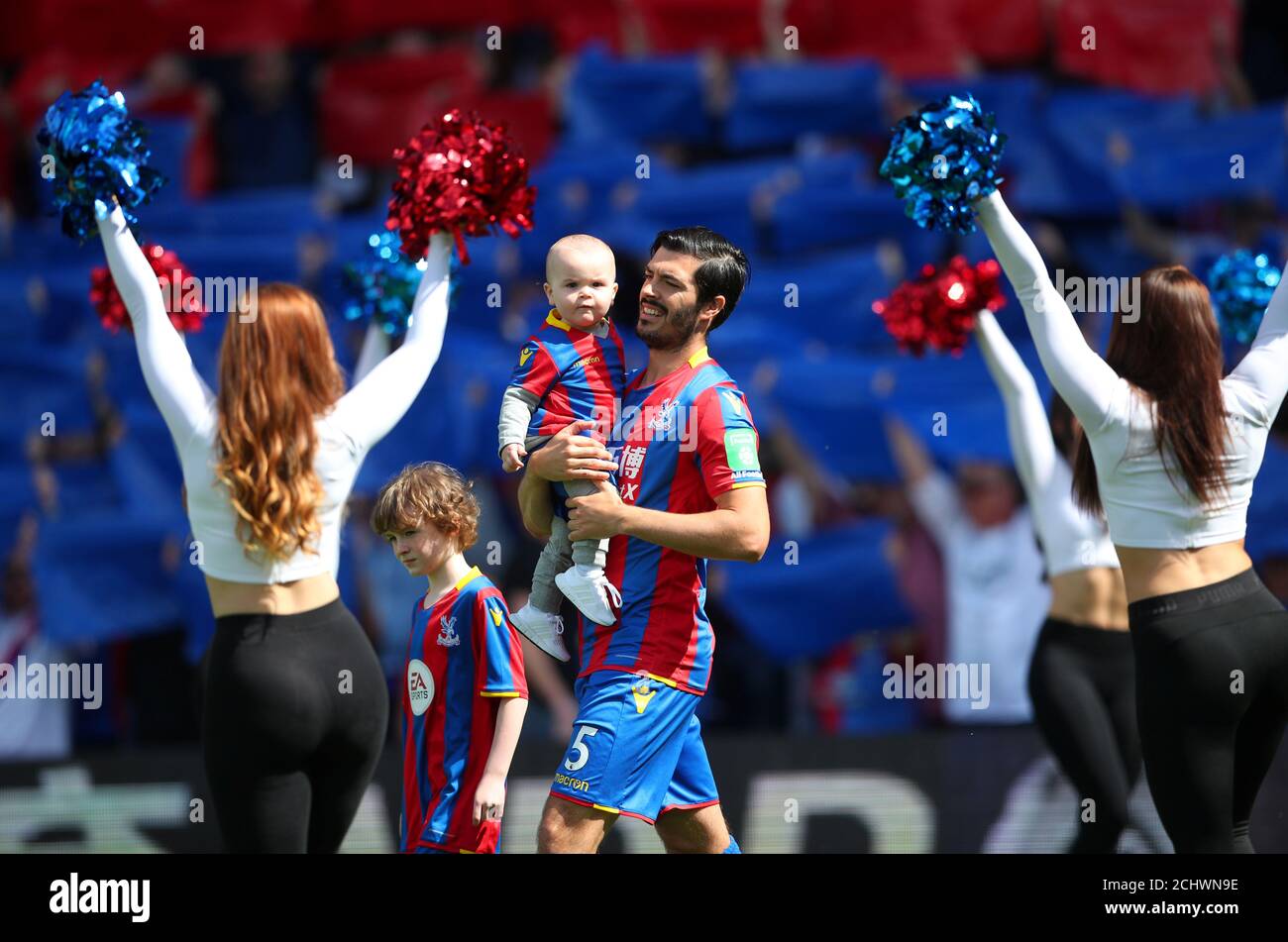 Soccer Football - Premier League - Crystal Palace vs West Bromwich Albion - Selhurst Park, London, Britain - May 13, 2018   Crystal Palace's James Tomkins walks out with children before the match   REUTERS/Hannah McKay    EDITORIAL USE ONLY. No use with unauthorized audio, video, data, fixture lists, club/league logos or 'live' services. Online in-match use limited to 75 images, no video emulation. No use in betting, games or single club/league/player publications.  Please contact your account representative for further details. Stock Photo