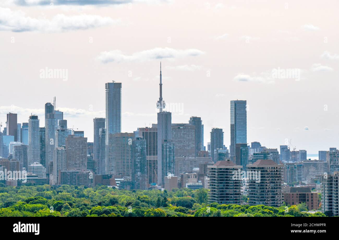 Strange pink orange colors covers southwest sky over Toronto on a normally sunny day, due to high atmospheric smog pollutants from the wildfires in American West Coast States of Washington, Oregon and California Stock Photo