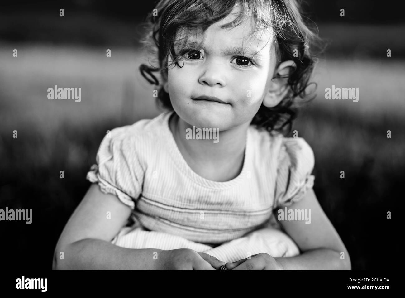Black and white portrait photo of a little, curly girl Stock Photo - Alamy