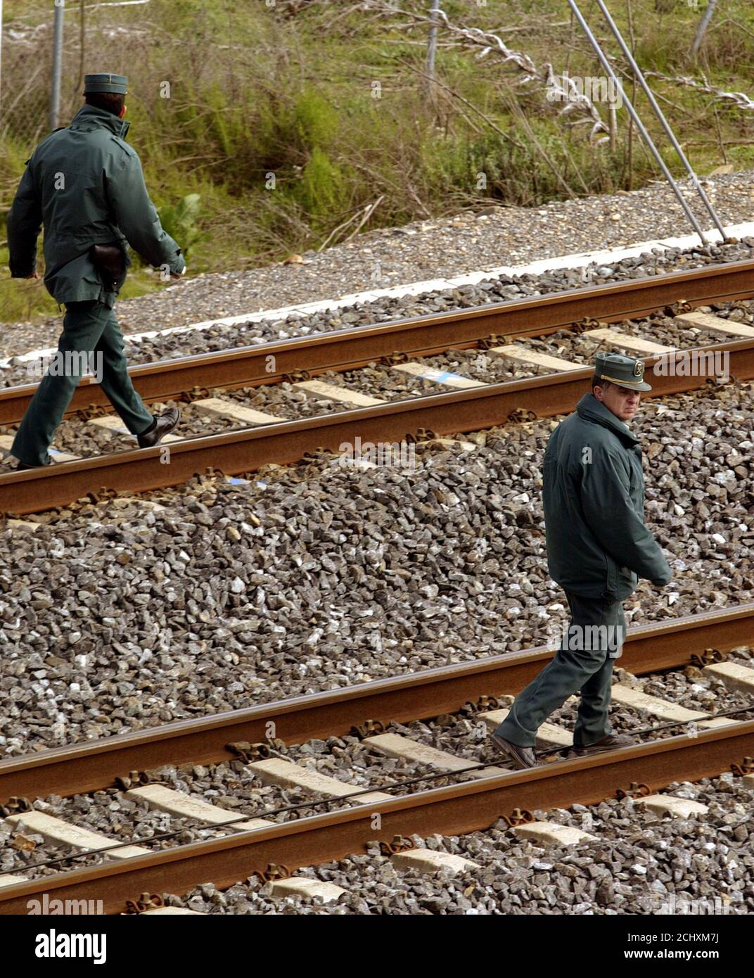 Two Spanish Civil Guards Inspect A Railway Track In The Central Village Of Mocejon April 2 04 Spain Will Bring In The Army To Guard Key Rail Lines After Discovery Of A