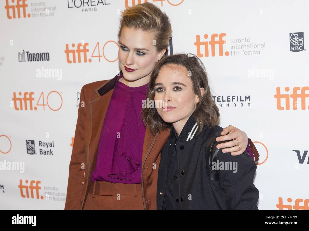 Ellen Page arrives with Evan Rachel Wood (L) on the red carpet for the film 'Into the Forest' during the 40th Toronto International Film Festival in Toronto, Canada, September 12, 2015. TIFF runs from September 10-20.   REUTERS/Mark Blinch Stock Photo