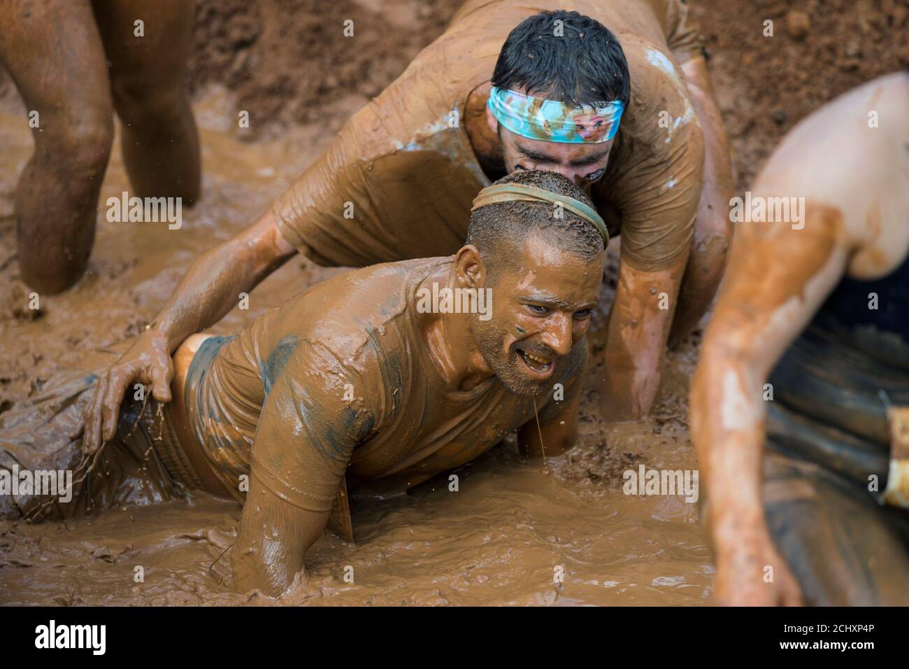 Participants take part in the first Mud Day Israel obstacle course race in Tel Aviv, Israel March 24, 2017.  REUTERS/Baz Ratner Stock Photo