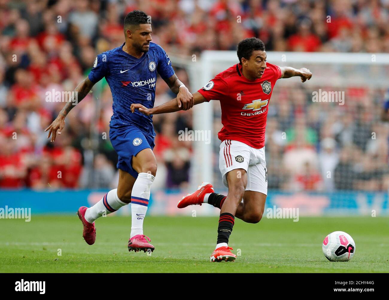 Soccer Football - Premier League - Manchester United v Chelsea - Old Trafford, Manchester, Britain - August 11, 2019  Chelsea's Emerson Palmieri in action with Manchester United's Jesse Lingard   REUTERS/Phil Noble  EDITORIAL USE ONLY. No use with unauthorized audio, video, data, fixture lists, club/league logos or 'live' services. Online in-match use limited to 75 images, no video emulation. No use in betting, games or single club/league/player publications.  Please contact your account representative for further details. Stock Photo