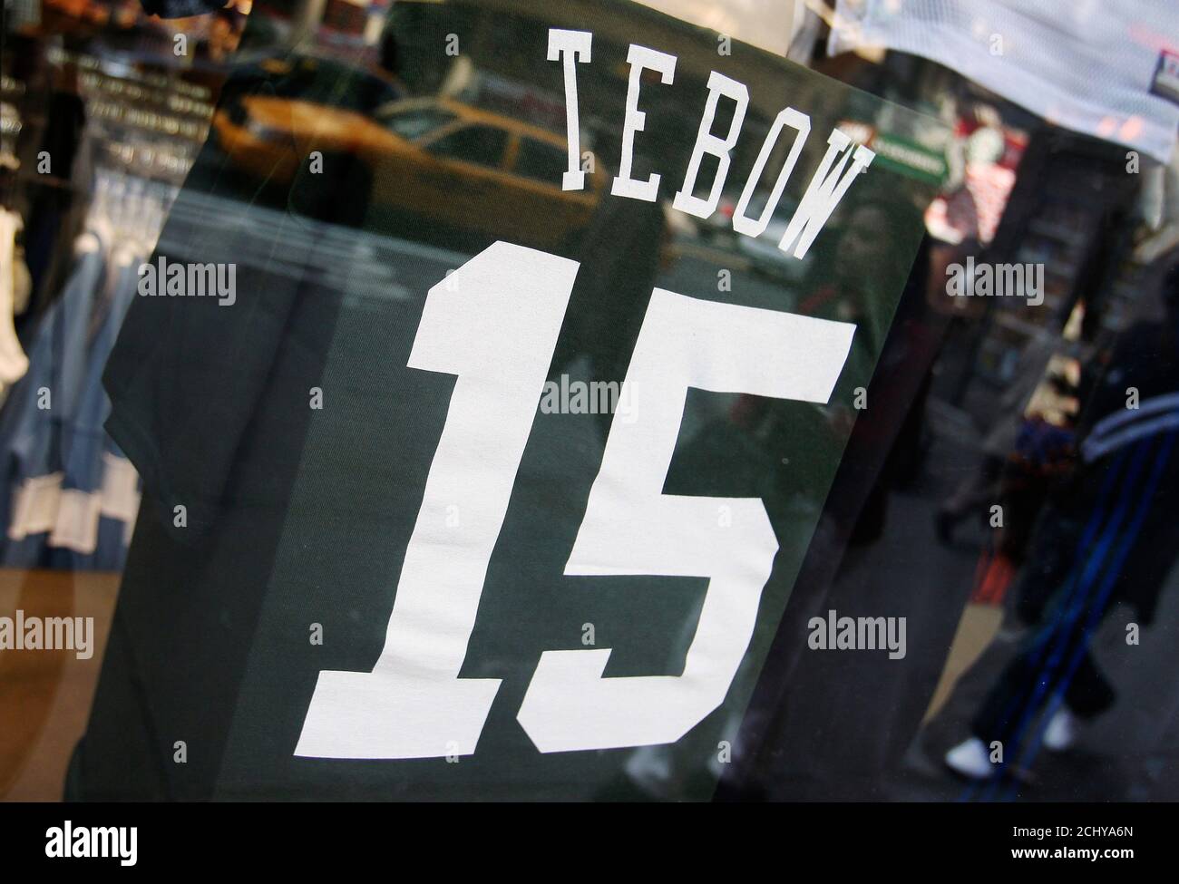 Tim Tebow's New York Jets shirts are put up for display in New York March 23, 2012. Trading for Tim Tebow and bringing 'Tebowmania' to New York quickened the pulse of Jets fans in the Big Apple, which has already had a 'Linsane' love affair this winter with the heartwarming rise of unsung Jeremy Lin with the NBA's Knicks. REUTERS/Shannon Stapleton (UNITED STATES - Tags: SPORT BUSINESS) Stock Photo