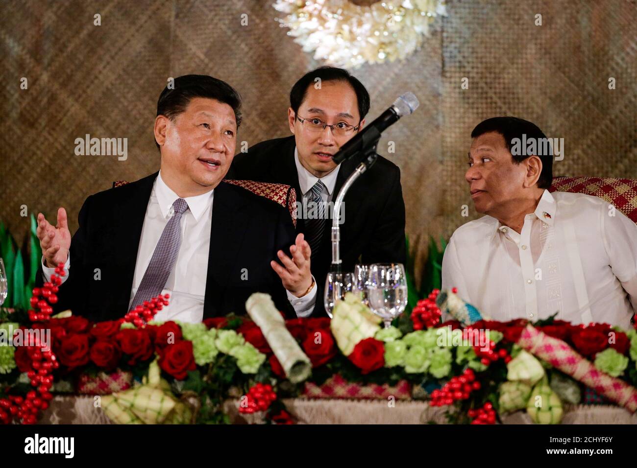 China's President Xi Jinping speaks as Philippine President Rodrigo Duterte listens during a State Banquet at the Malacanang presidential palace in Manila, Philippines, November 20, 2018.   Mark Cristino/Pool via Reuters Stock Photo