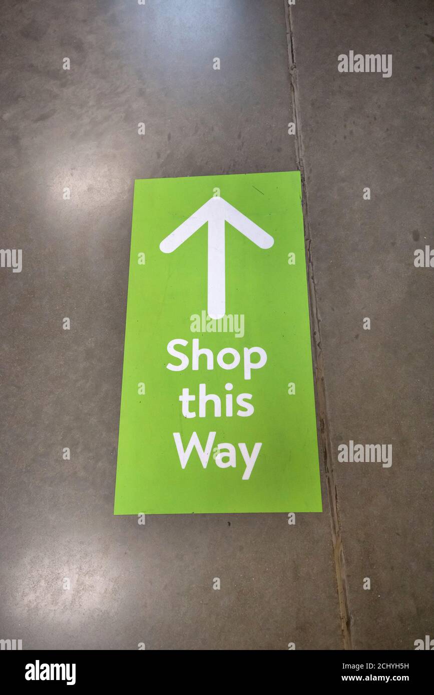 Covid 19 directional shopping signs inside store. Stock Photo