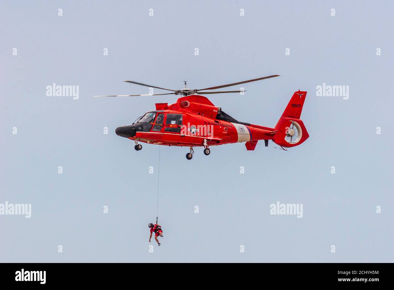6518 MH-65 Dolphin Helicopter rescue demonstration at Wings Over Houston Air Show Stock Photo