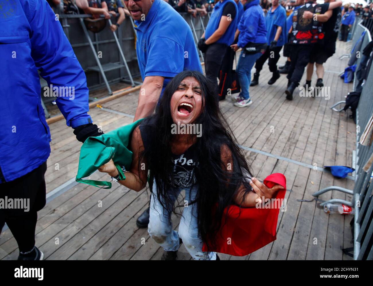 A Mexican heavy metal fan freaks out in front of the stage of American  heavy metal band Anthrax from New York City at the world's largest heavy  metal festival, the Wacken Open