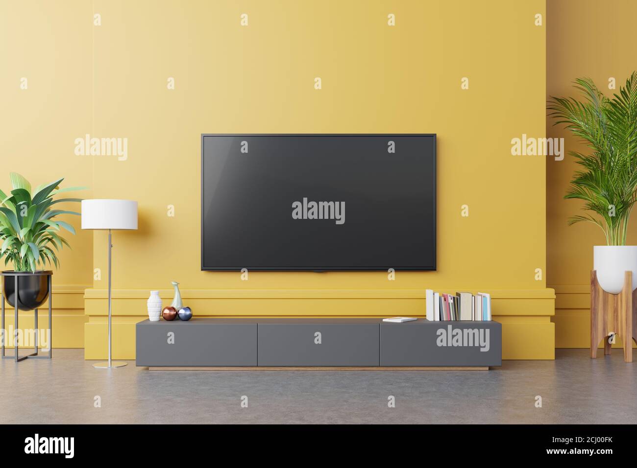 TV on cabinet in modern living room with lamp,table,flower and plant on  yellow wall background,3d rendering Stock Photo - Alamy