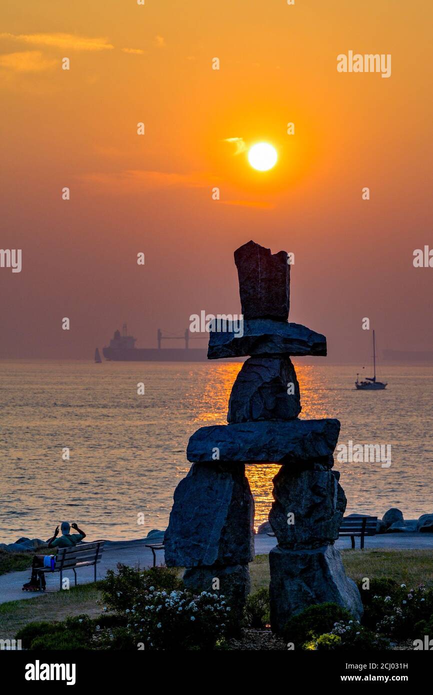 Smoke haze, sunset, Inukshuk, English Bay, Vancouver, British Columbia, Canada Stock Photo