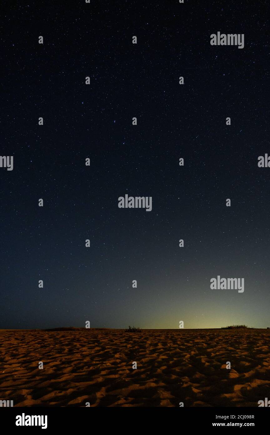 Beautiful vertical shot of a starry night sky at the beach Stock Photo ...