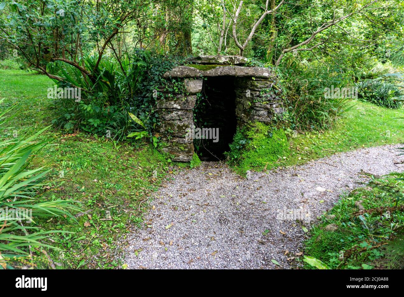 An old stone structure housing an old water well. Stock Photo