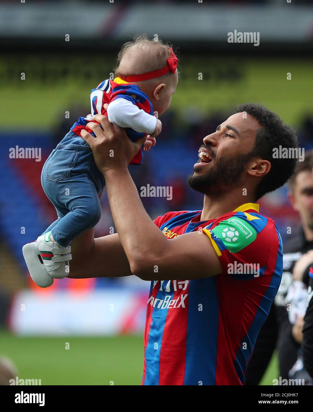 Soccer Football - Premier League - Crystal Palace vs West Bromwich Albion - Selhurst Park, London, Britain - May 13, 2018   Crystal Palace's Andros Townsend with child after the match   REUTERS/Hannah McKay    EDITORIAL USE ONLY. No use with unauthorized audio, video, data, fixture lists, club/league logos or "live" services. Online in-match use limited to 75 images, no video emulation. No use in betting, games or single club/league/player publications.  Please contact your account representative for further details. Stock Photo