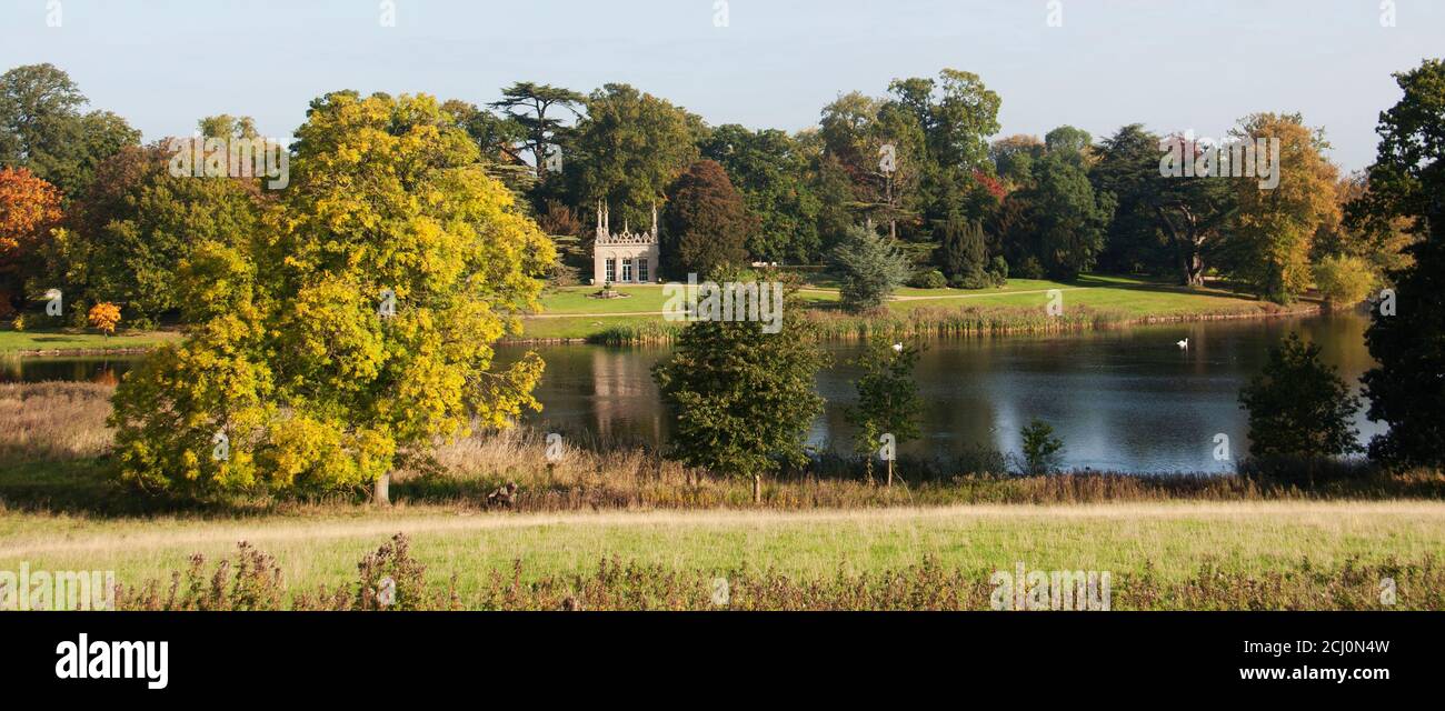 A peaceful lake-side view of Capability Brown's Neo-Jacobean Banqueting House in the Pleasure Garden at Burghley Stock Photo