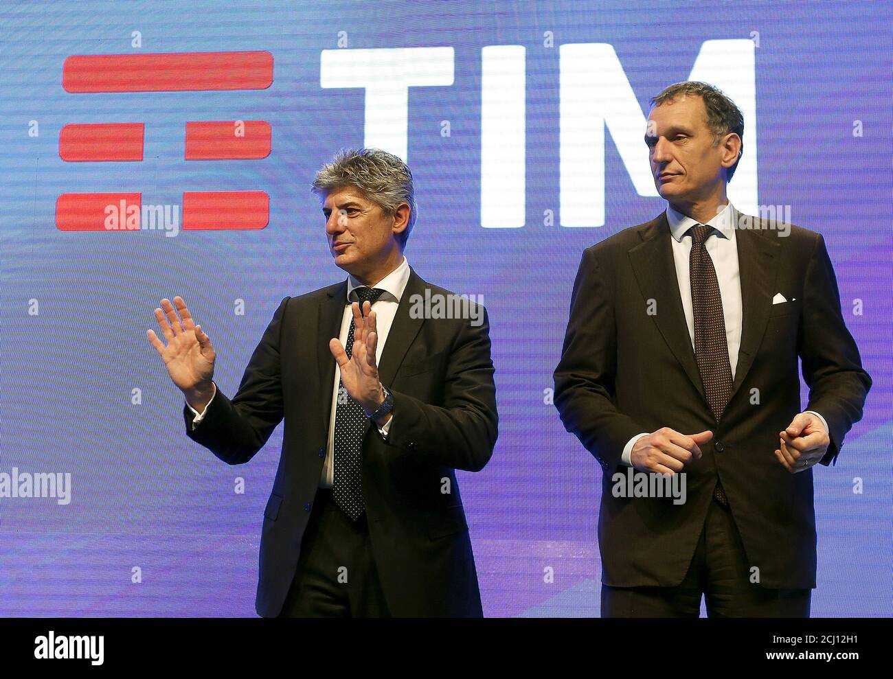 Telecom Italia CEO Marco Patuano (L) gestures next to chairman Giuseppe  Recchi during the launch of