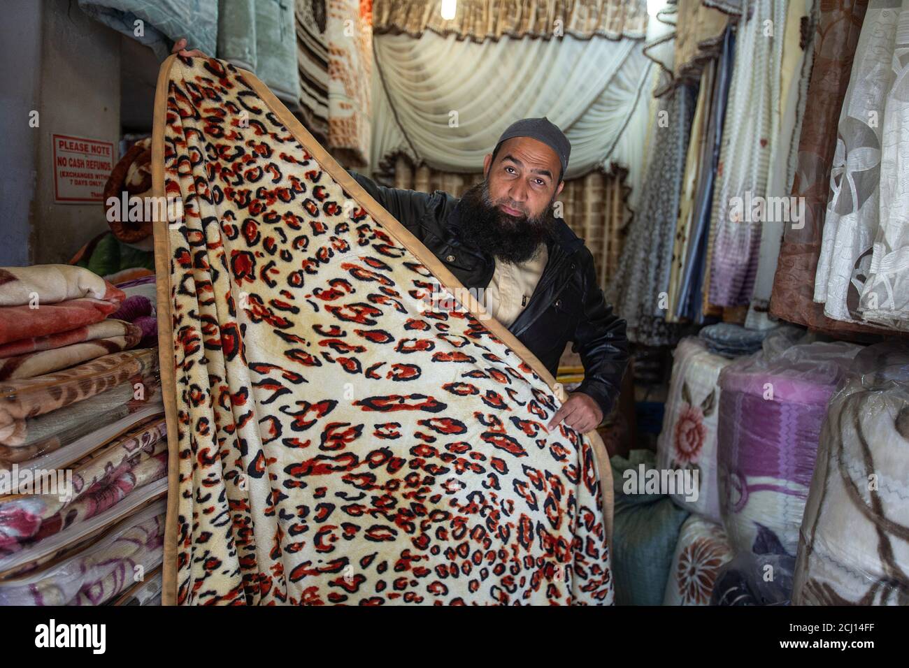 Indian male selling traditional African blankets in Johannesburg, South