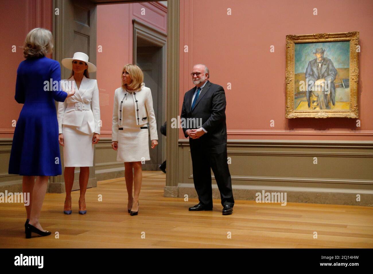 United States first lady Melania Trump and her French counterpart Brigitte  Macron visit a gallery of Cezanne paintings during a tour of the National  Gallery of Art in Washington, U.S., April 24,