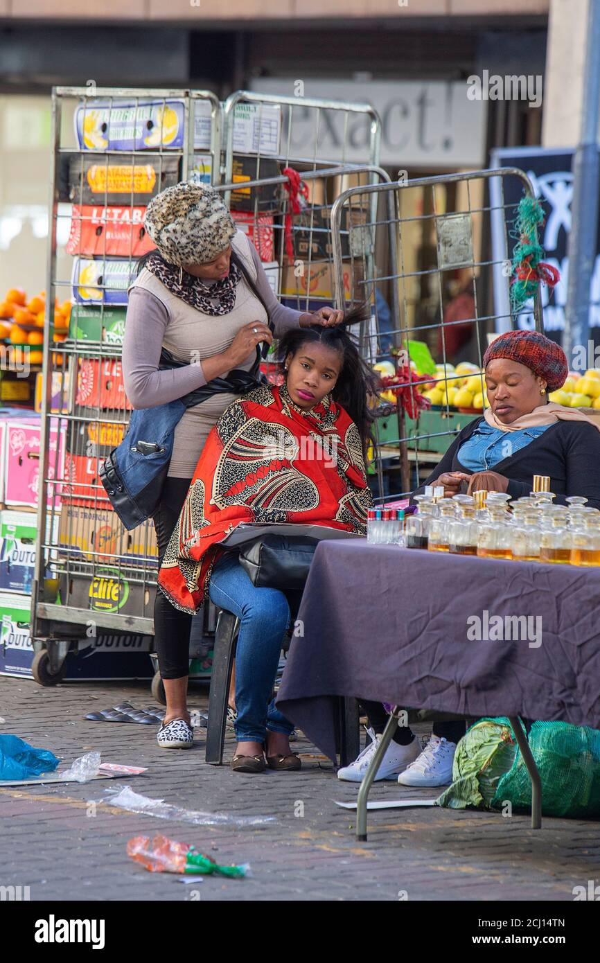 Tyical African hair weaving and braiding stall in Johannesburg, South Africa Stock Photo